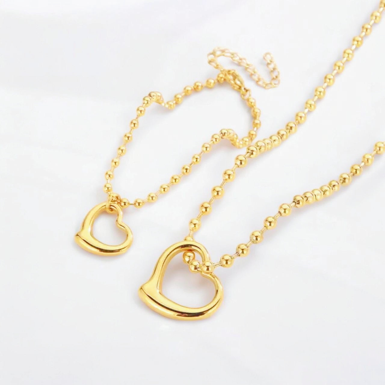 Conjunto de Collar y Pulsera en Oro y Plata con Dije de Corazón Moderno